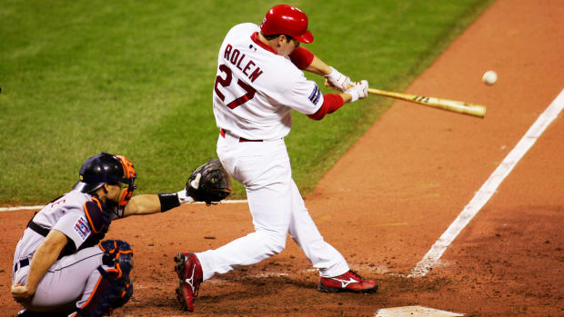 Oct 26, 2006; St. Louis, MO, USA; St. Louis Cardinals third baseman Scott Rolen hits a double during the 6th inning of game 4 of the World Series against the Detroit Tigers at Busch Stadium in St. Louis, Missouri.